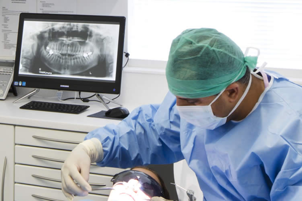 maxillofacial surgeon performing procedure