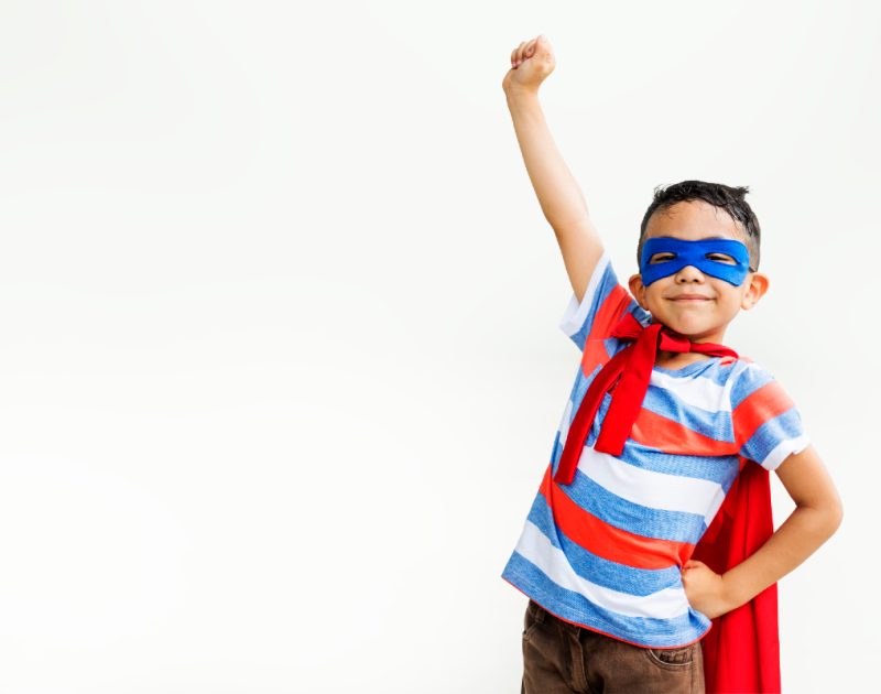 Little boy in superhero costume