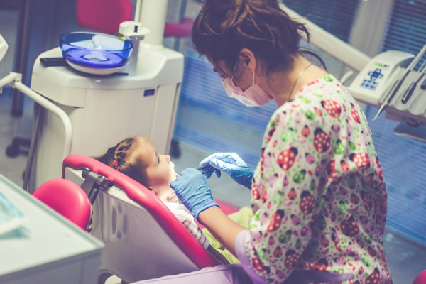 Small girl having dental check up