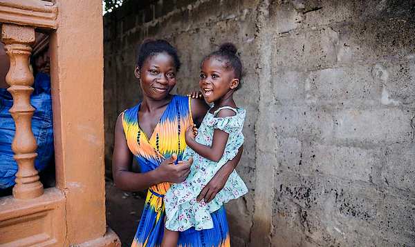 Girl with mother after tumour removed
