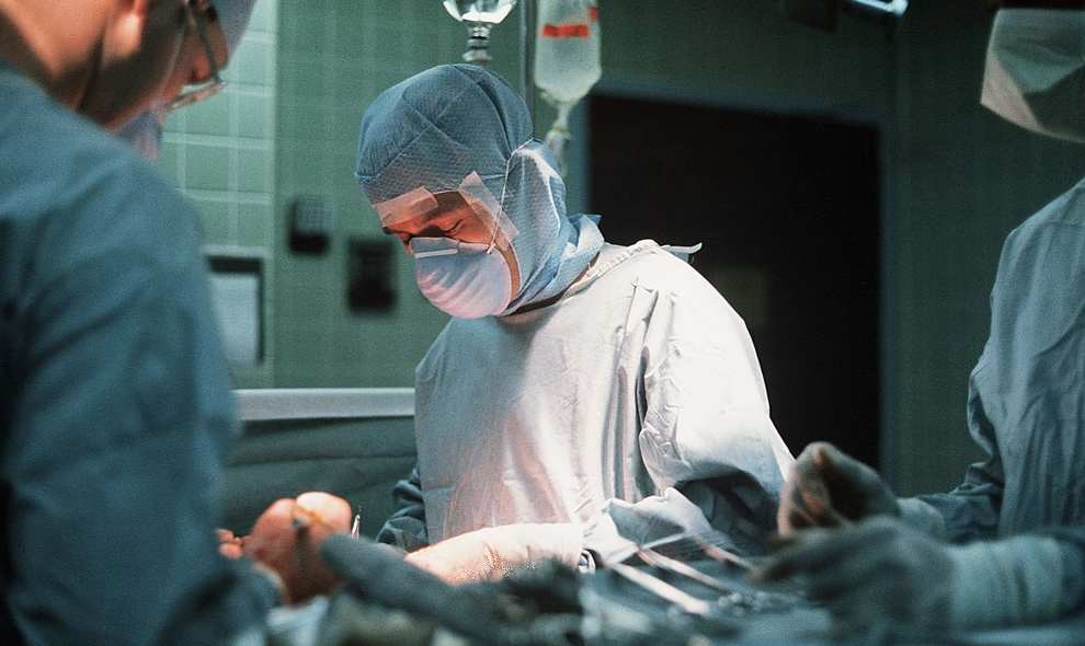 Surgeon carrying out facial operation